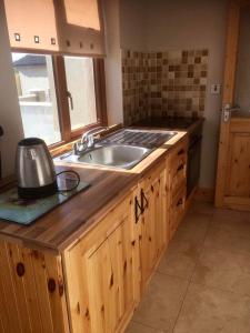 a kitchen with a sink and a counter top at Kathleen’s Haven in Causeway