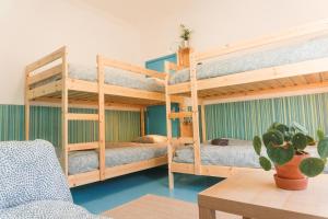 Postel nebo postele na pokoji v ubytování Hospedium Hostel República Surf House