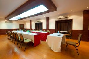 a conference room with tables and chairs and a skylight at Siris 18 in Gurgaon