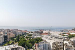 an aerial view of a city and the ocean at Sky Studios in Thessaloniki