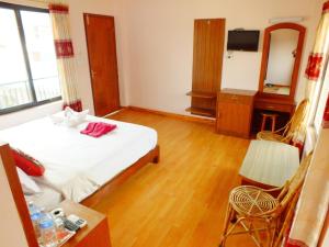 Una cama o camas en una habitación de Hotel Greenland