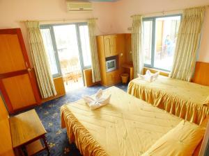 Una cama o camas en una habitación de Hotel Greenland
