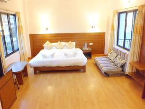 Una cama o camas en una habitación de Hotel Greenland