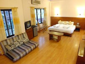 Una cama o camas en una habitación de Hotel Greenland