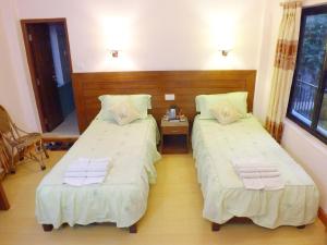 Una cama o camas en una habitación de Hotel Greenland