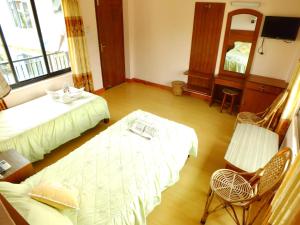 Una cama o camas en una habitación de Hotel Greenland