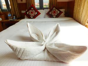 Una cama o camas en una habitación de Hotel Greenland