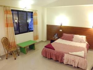 Una cama o camas en una habitación de Hotel Greenland