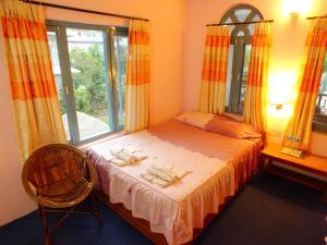 Una cama o camas en una habitación de Hotel Greenland
