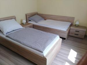 Postel nebo postele na pokoji v ubytování Ubytování Bludov u lázní