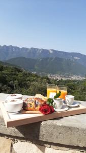 a tray of food sitting on a table with drinks at Casal Gabriele in Lettere