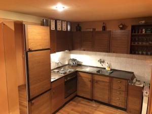 Kuchyň nebo kuchyňský kout v ubytování Loli Caffe Apartment