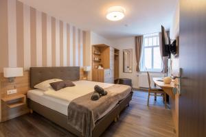 Кровать или кровати в номере Hotel Steyerberger Hof