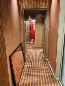 a corridor of a hallway with at Hôtel du Vieux Marais in Paris