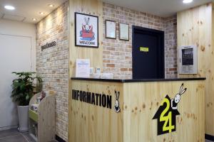 a vaccination station in a room with a brick wall at 24 Guesthouse Myeongdong Avenue in Seoul