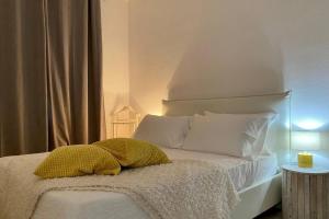 En eller flere senge i et værelse på Oasi Vacation Rental