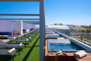 a swimming pool on the roof of a building at Sensus Experience by Lavris in Gouves