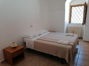 Ένα ή περισσότερα κρεβάτια σε δωμάτιο στο Casa Natura Gargano