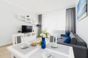 Televízia a/alebo spoločenská miestnosť v ubytovaní Apartment Smoluchowskiego Cracow by Noclegi Renters