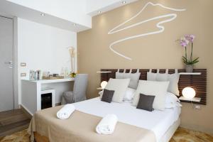 Кровать или кровати в номере La Maison des Tout le Monde