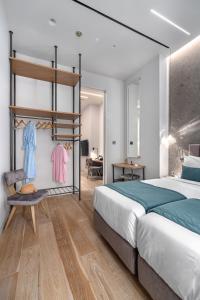 Ένα ή περισσότερα κρεβάτια σε δωμάτιο στο Hellenic Vibes Smart Hotel