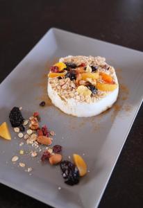 a dessert on a white plate on a table at Margo Beach Hotel in Gythio