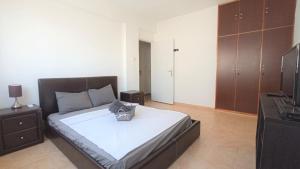 a bedroom with a bed with a basket on it at 5 min to the Beach Holiday Shared Apartment - private ROOM in 3 bdr Apt in Larnaka