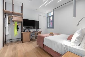Ένα ή περισσότερα κρεβάτια σε δωμάτιο στο Hellenic Vibes Smart Hotel