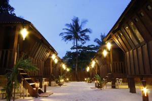 a courtyard of a building with lights at night at Casitas de Boracay in Boracay