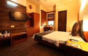 Cama o camas de una habitación en Hotel Royal Castle Grand