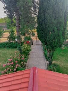 a view of a garden with a red roof at Hotel Kakhaberi in Tʼetʼri Tsqaro
