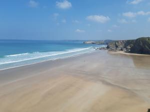 an aerial view of a beach with the ocean at Nice big 2 double bedroom Apartment in the Town in Newquay