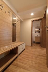 a bathroom with a large mirror on the wall at Villa Marina Inn in Siófok +16 photos