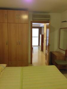 Cama o camas de una habitación en Apartamentos Benidorm City