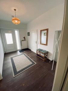 an empty living room with a couch and a rug at Haus Lavendel in Vinningen