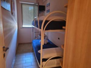 a room with several bunk beds in a room at Casa Centurione Silvi Marina in Silvi Marina +4 photos