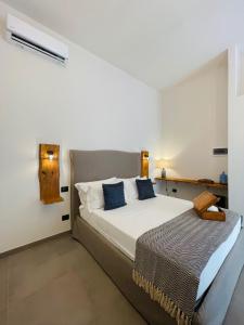 Postel nebo postele na pokoji v ubytování Dimora Terranova Charming Rooms