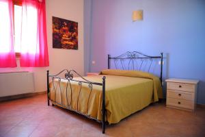 Postel nebo postele na pokoji v ubytování Agriturismo Mele