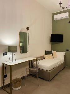 TV a/nebo společenská místnost v ubytování Dimora Terranova Charming Rooms