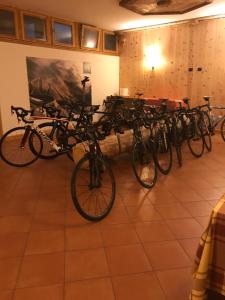 a bunch of bikes parked in a room at Hotel Villa Rina in Bormio