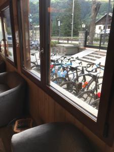 a group of bikes parked outside a window at Hotel Villa Rina in Bormio