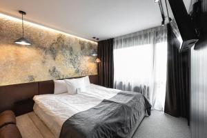 Postel nebo postele na pokoji v ubytování Stara Pravda Hotel