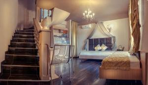 a bedroom with a staircase leading to a bed and a bed sqor at Abbacy Katiana's Castelleti 1 in Limenas