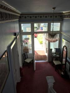 an open door to a room with a hallway at Dorstan House in Edinburgh