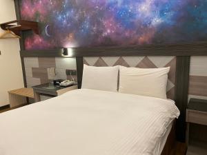 En eller flere senger på et rom på Weifeng Boutique Business Hotel - Zhanqian Branch