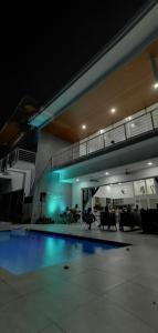 a swimming pool in a building at night at Casa Paraiso Azul Ocean View in Camaronal