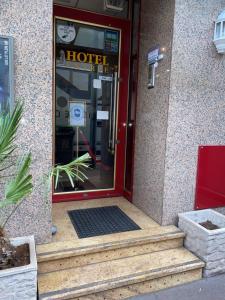 an entrance to a hotel with the door open at Aero Hotel in Issy-les-Moulineaux