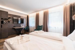 Postel nebo postele na pokoji v ubytování Hotel Demas München-Unterhaching