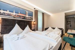Postel nebo postele na pokoji v ubytování Hotel Demas München-Unterhaching
