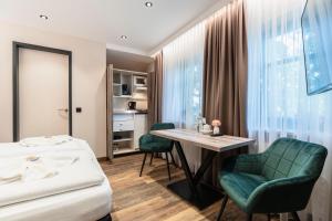 Kuchyň nebo kuchyňský kout v ubytování Hotel Demas München-Unterhaching